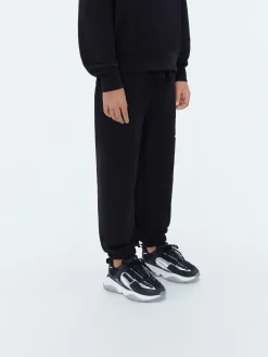 AMIRI STAGGERED SCRIBBLE SWEATPANT