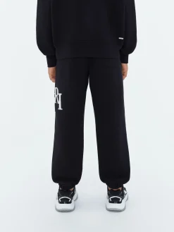 AMIRI STAGGERED SCRIBBLE SWEATPANT