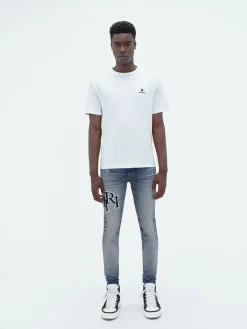 STAGGERED EMBROIDERED LOGO JEAN